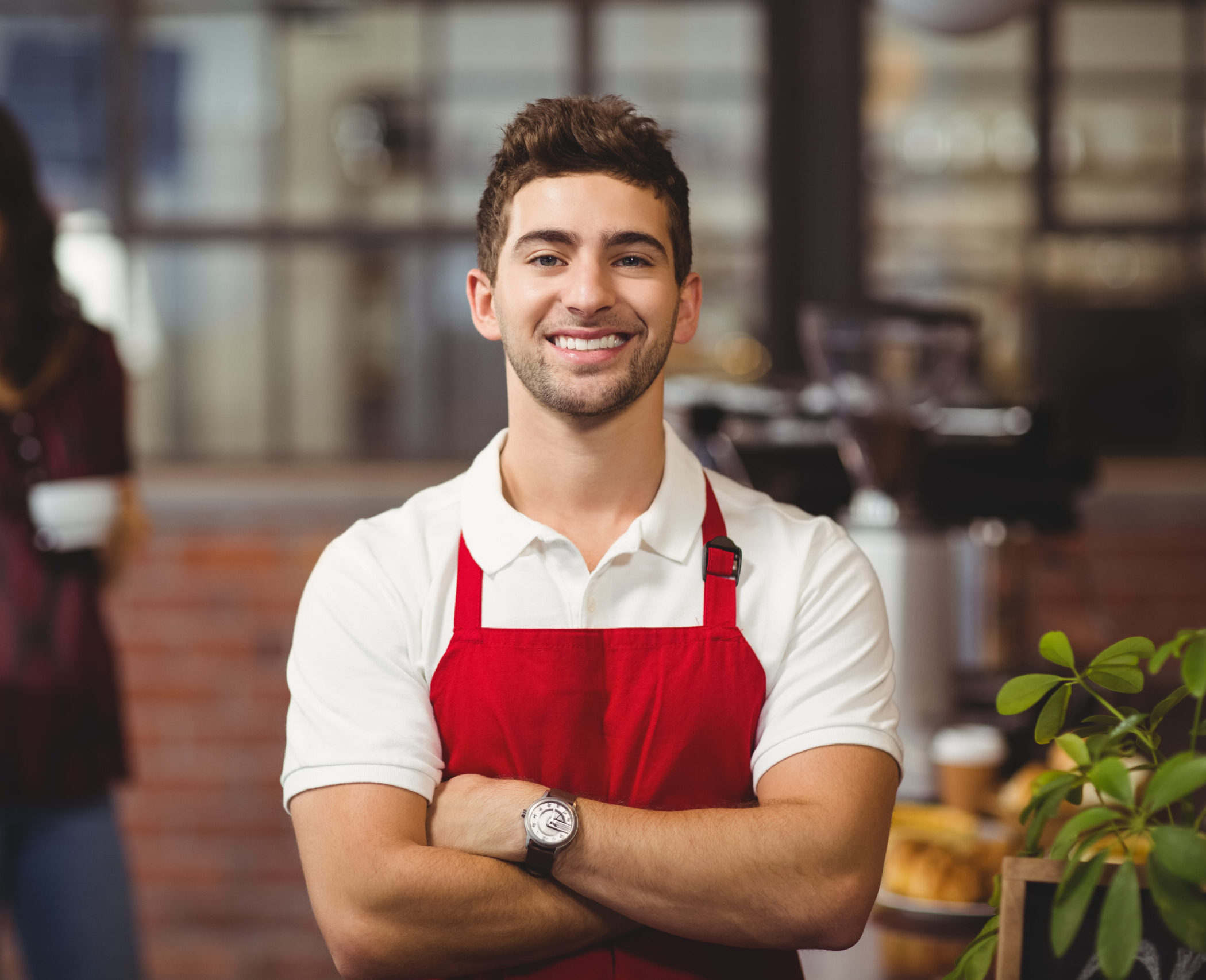 577 Gladstone Ave _15 Portrait of a waiter with arms crossed at the coffee shop