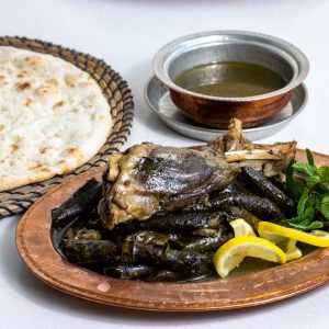 Stuffed grape leaves with lamb shank