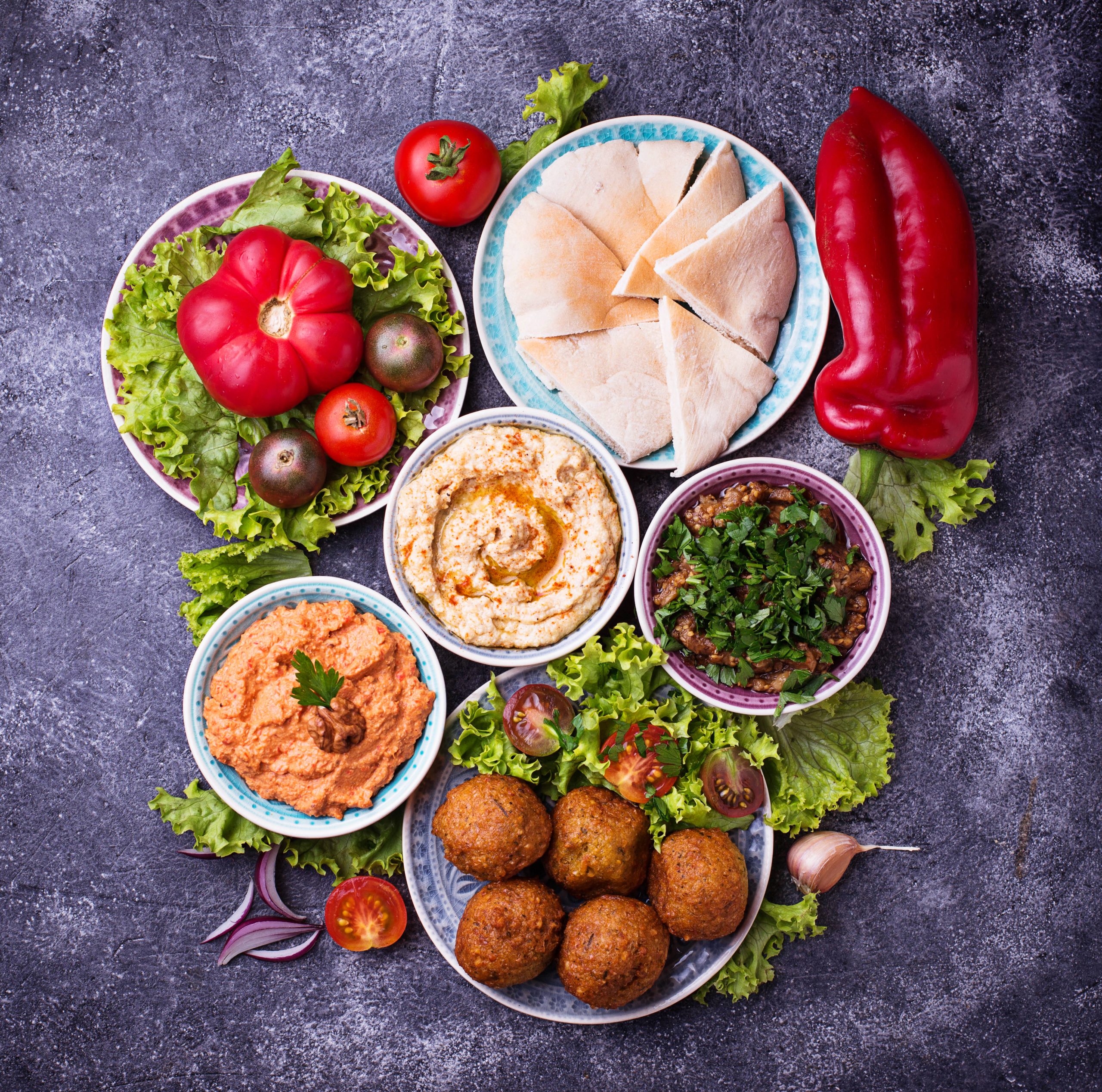 A selection of Middle Eastern and Arabic dishes. Top view - dark background.