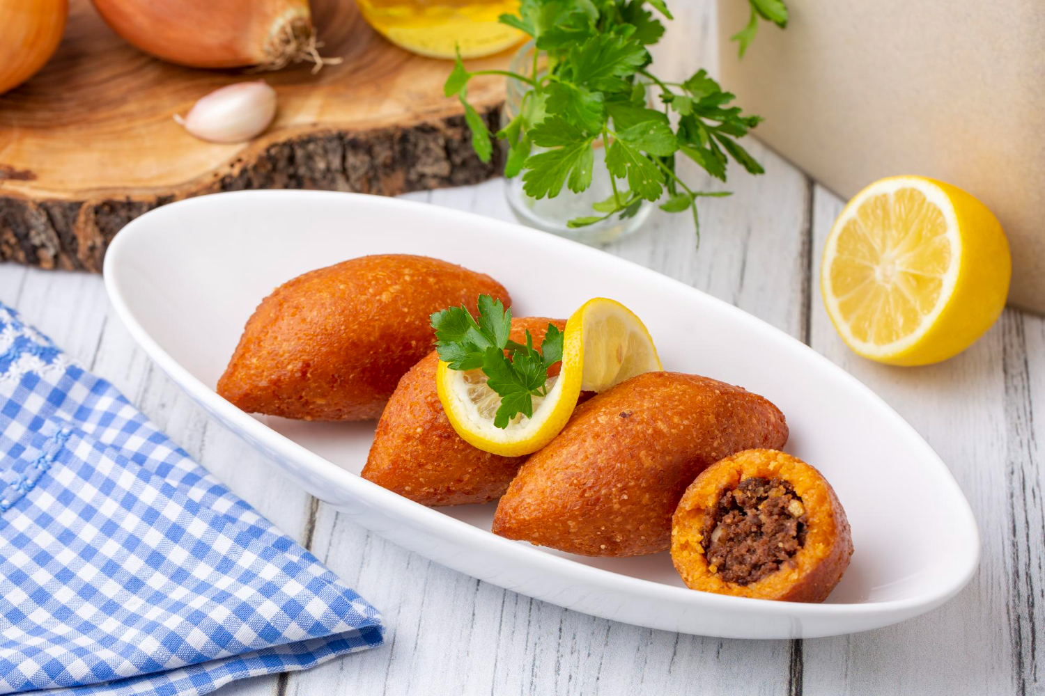 Kibbeh made from meat and bulgur, showing the difference from falafel