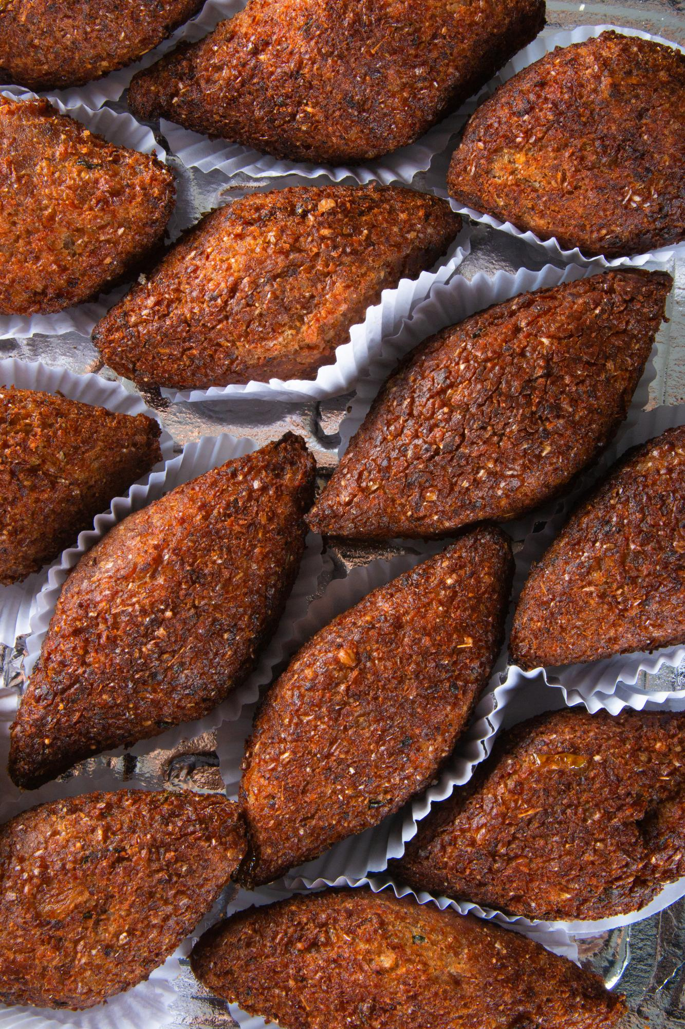 Grilled Middle Eastern kibbeh prepared as part of a charcoal grill meal