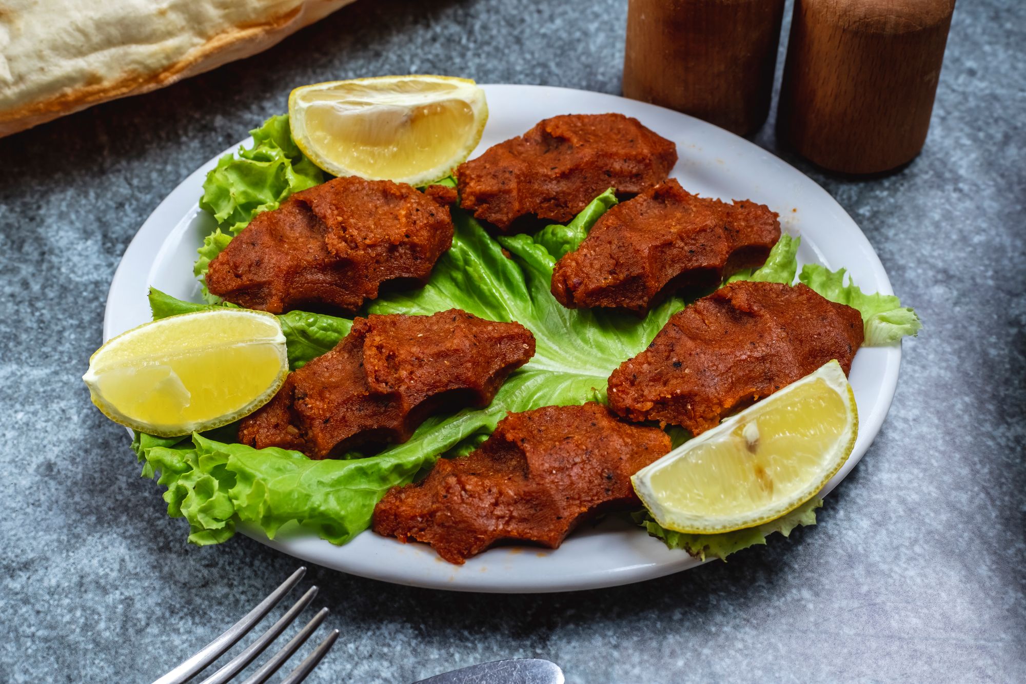 Kibbeh nayyeh style presentation representing raw kibbeh in Syrian and Lebanese cuisine