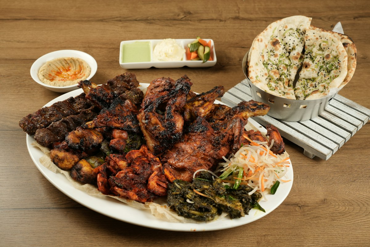 Illustrative platter of grilled meat and bread